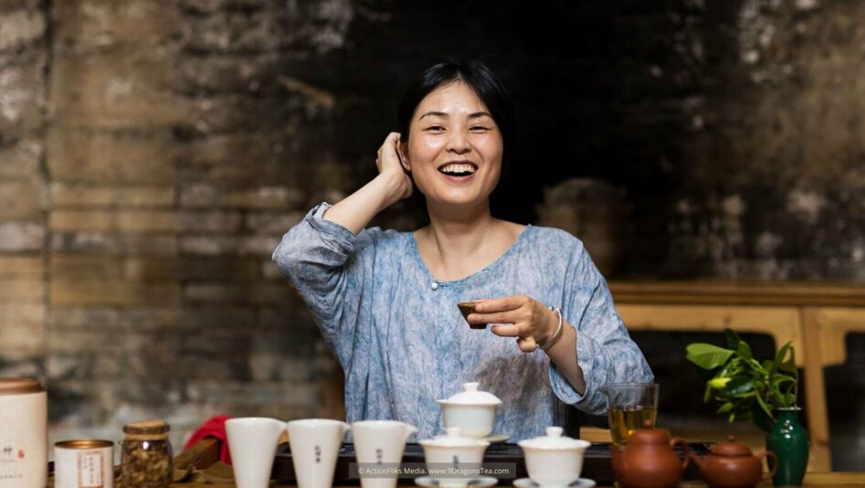 Wuyishan culture Chinese tea rituals tea tasting lady holding a cup smiling happy tea drinking