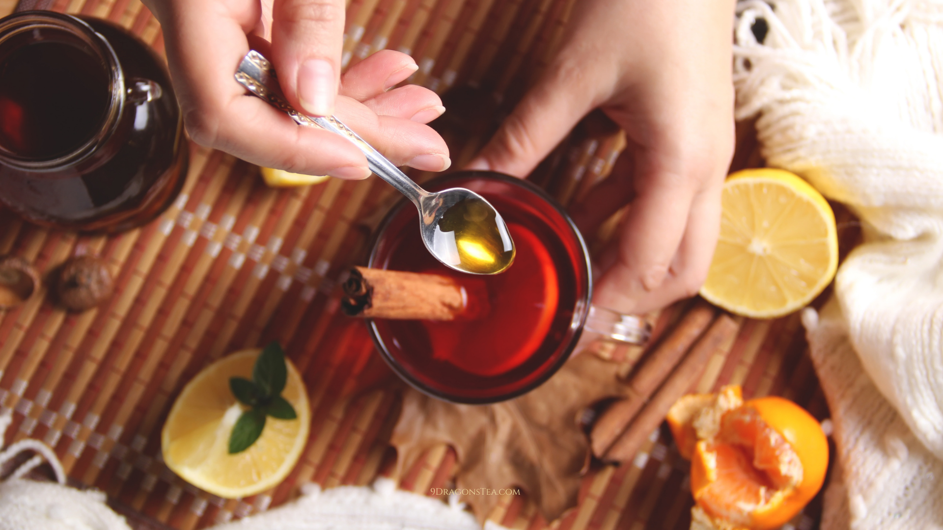 a-teaspoon-of-honey-poured-into-a-cup-of-black-tea
