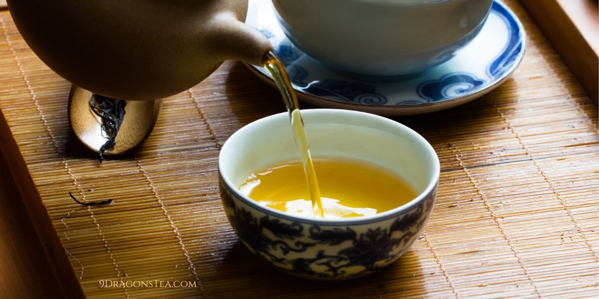 green tea pouring into chinese teacup